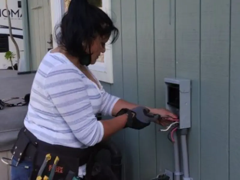 Licensed electrician wiring an exterior subpanel in Caddo Mills